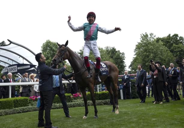 Frankie Dettori jumps from Enable after winning The King George VI & Queen Elizabeth QIPCO Stakes Race at Ascot on Saturday.