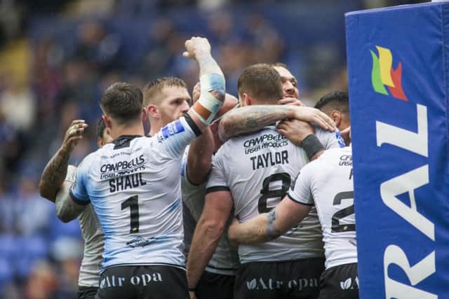 Well done: Hull's Scott Taylor celebrates his try with team-mates.