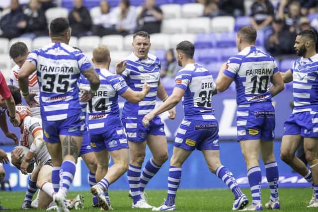 Keeping them out: Halifax's Ed Barber celebrates turning over St Helens.