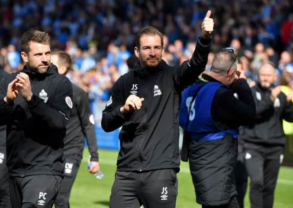 Thumbs up: Huddersfield Town head coach Jan Siewert salutes the fans after the final whistle of the Premier League draw against Manchester United.