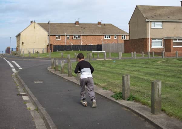 HARTLEPOOL, ENGLAND - SEPTEMBER 04:  Children play on the streets of the Headlands area of Hartlepool on September 4, 2017 in Hartlepool, England. Hartlepool in the North East of England is one of the many coastal towns lagging behind inland areas with some of the worst levels of economic and social deprivation in the country. The Social Market Foundation (SMF) found that 85% of Great Britain's 98 coastal local authorities had pay levels below the national average for 2016. The government has announced that it will give 40 million GBP to encourage tourism and boost employment in the areas.  (Photo by Christopher Furlong/Getty Images)