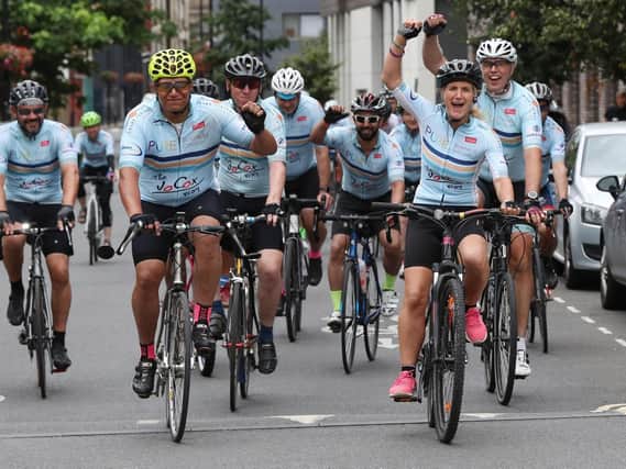 Sister of murdered MP Jo Cox, Kim Leadbeater (second right) leads bike riders into Flat Iron Square in London for the charity ride in memory of Jo.