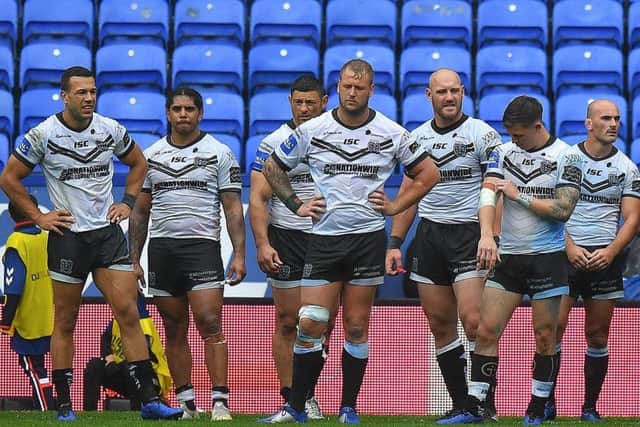 Gareth Ellis (third-right) and fellow dejected Hull FC players  during the Coral Challenge Cup semi-final defeat to Warrington Wolves. PIC: Dave Howarth/PA Wire
