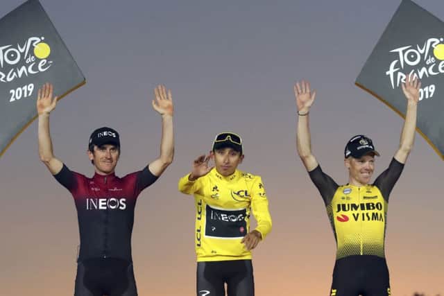 Colombia's Egan Bernal, middle, Britain's Geraint Thomas, who placed second, left, and the Netherlands' Steven Kruijswijk, third, celebrate on the podium of the Tour de France. Picture: AP/Thibault Camus