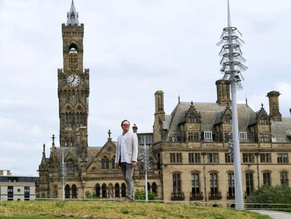 David Wilson with Bradford City Hall in the background. Picture by Jonathan Gawthorpe.