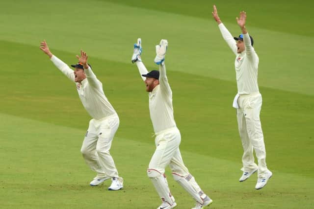 England wicketkeeper Jonny Bairstow (c) Joe Root (r) and Jason Roy celebrate after Stuart Broad had dismissed Kevin O' Brien during day three of the Specsavers Test Match between England and Ireland at Lord's. Picture: Stu Forster/Getty Images
