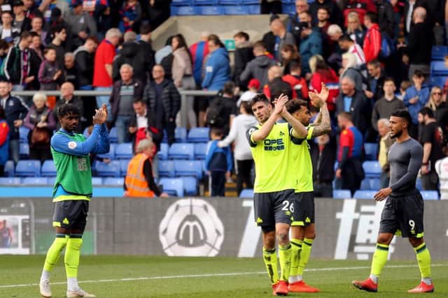 Going down: Huddersfield Town's Christopher Schindler and his team-mates applaud the fans after relegation from the Premier League is confirmed at Selhurst Park on Saturday March 30.