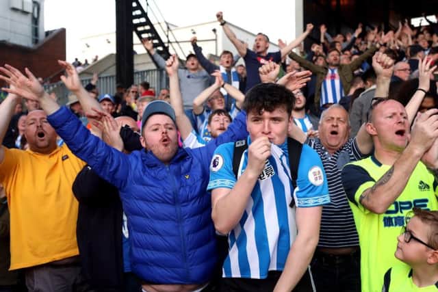 Huddersfield Town fans applaud their team after the Premier League match at Selhurst Park despite their relegation being confirmed with other results. (Picture: Isabel Infantes/PA Wire)