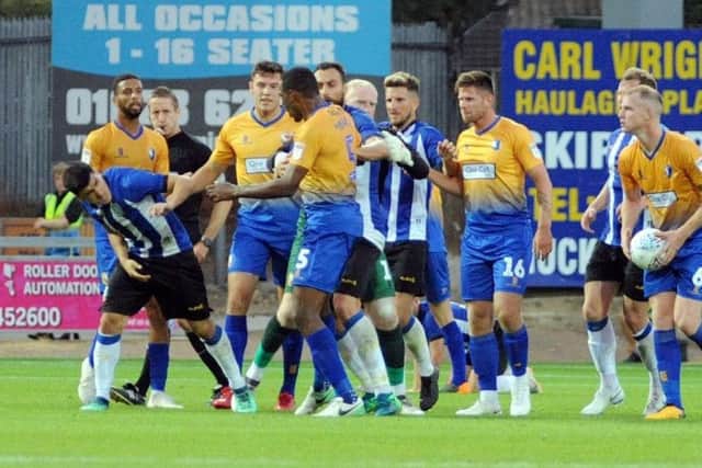 Fernando Forestieri gets involvved in an altercation with Mansfield's Krystian Pearce during pre-season last summer (Picture: Anne Shelley)