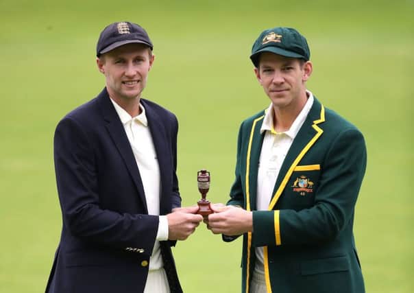 England captain Joe Root (left) and Australia captain Tim Paine pose with the Ashes urn during the nets session at Edgbaston. Picture: Nick Potts/PA