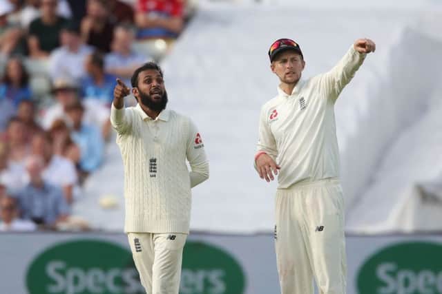 Adil Rashid (left) talks with England captain and Yorkshire team-mate Joe Root during the First Test match against India at Edgbaston last year. Picture: Nick Potts/PA