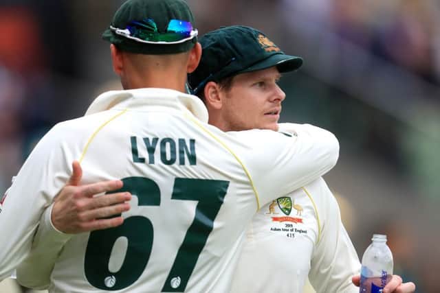 Australia's Steve Smith is greeted by Nathan Lyon after being dismissed during day one of the Ashes Test match at Edgbaston