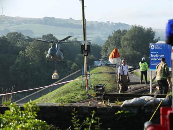 RAF Chinook drafted in at Todbrook Reservoir, Derbyshire, after Whaley Bridge residents evacuate their homes following heavy rainfall
