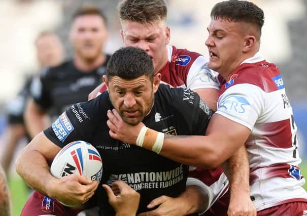 Held: 
Hull's Mark Minichiello is tackled short of Wigan's line.
 
Picture: Jonathan Gawthorpe