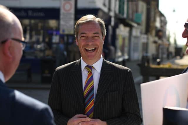 Brexit Party leader Nigel Farage speaks to members of the public during a 'walkabout' campaigning for the European Parliament election in Pontefract in May.