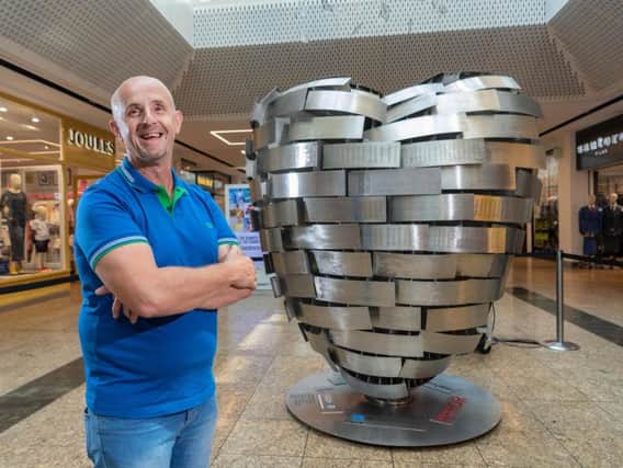 Barnsley father Tony Surgey, a retired police officer, is among those backing the British Heart Foundation's 'Heart of Steel'. The 52-year-old, diagnosed with a heart tumour, engraved his father in law's name on the steel sculpture.