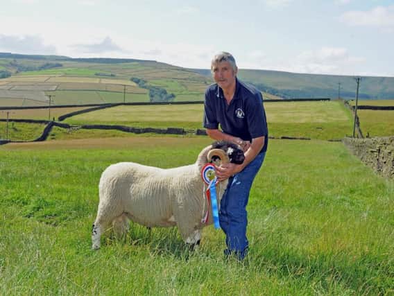 Clive Mitchell with his Great Yorkshire Show breed champion Lonk ram. Picture by Tony Johnson.