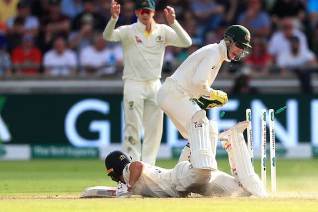 England's Rory Burns is almost run out during day two of the Ashes Test match at Edgbaston.