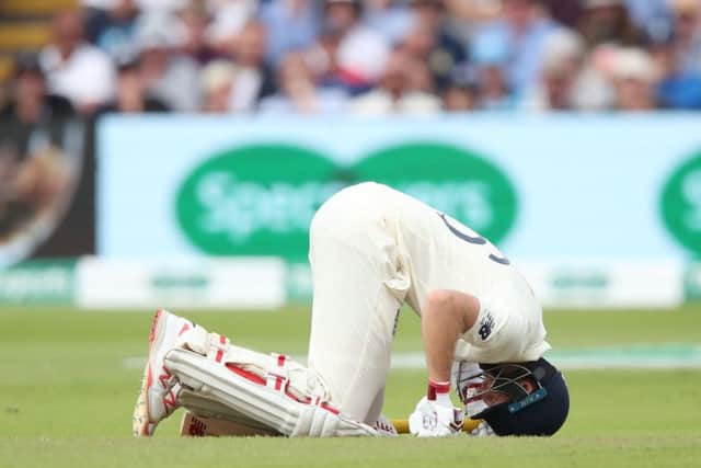 Joe Root in pain after being hit