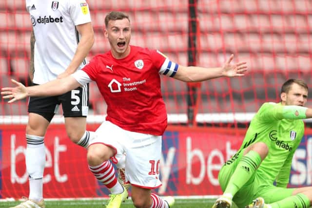 Denied: Barnsley captain Mike Bahre has a penalty appeal rejected after hitting the ball wide.