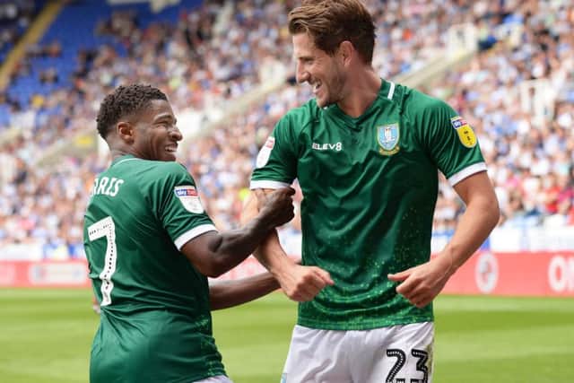 On target: First day of term celebrations from Owls goal-scorers Kadeem Harris and Sam Hutchinson.