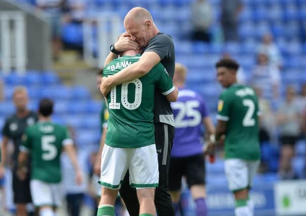 Happy day: Owls caretaker manager Lee Bullen with Barry Bannan after Saturday's win at Reading. Picture: Steve Ellis
