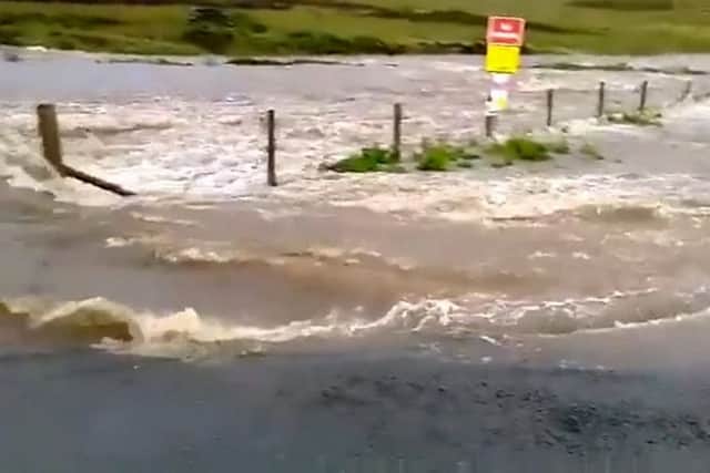 Flooding on the road between Grinton and Leyburn.  Picture: SWNS