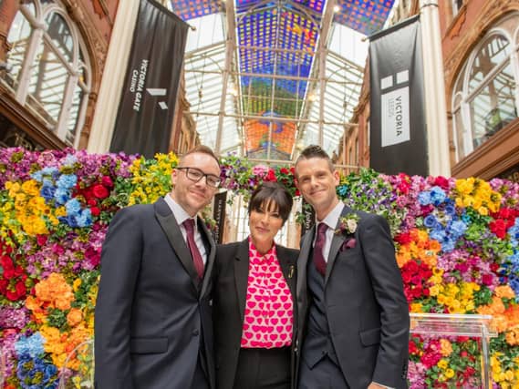 Leeds Pride wedding grooms Ryan Clay and Ben Bagshaw with celebrity celebrant TV's Anna Richardson at Victoria Leeds. Photo by Bevan Cockerill