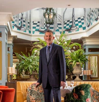 Malcolm wears navy pinstripe suit - a retro stripe from 1933 - in merino cloth with a silk stripe, woven by JH Clissold of Bradford and sold by Holland & Sherry, then tailored by Oxxford Clothes of Chicago with 7,000 hand stitches and costing $8,000. Picture by James Hardisty at The Ivy Harrogate.