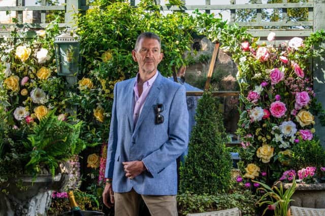 In the garden at The Ivy Harrogate, Malcolm wears blue Egyptian line,/cotton jacket, woven by Golden Tex of Cairo and tailored by Baird of Leeds. Picure by James Hardisty.