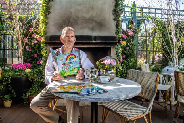 In the garden at The Ivy Harrogate, Malcolm reads from his children's book Weaver of a Life in Colour. He is wearing a waistcoat in the Callanish Tartan, the only registered Harris Tweed tartan, designed by Malcolm and based on the Balmoral Tartan, woven by the Carloway Mill on the Isle of Lewis and tailored by Carl Stuart in Ossett. Picture by James Hardisty.