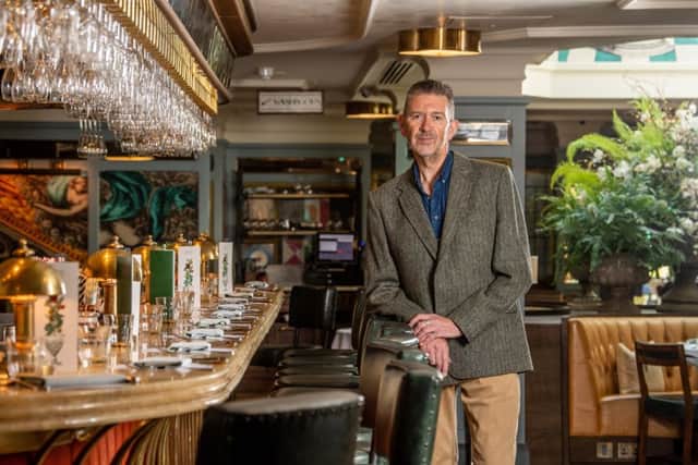 Malcolm wears a jacket in his own design of Harris Tweed, in salmon bone weave in Royal Estate Loden colour, woven by the Caloway Mill on the Isle of Lewis and tailored by Carl Stuart of Ossett. Picture by James Hardisty at The Ivy Harrogate.