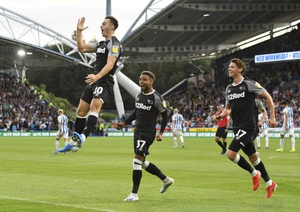 DOUBLE TROUBLE: Tom Lawrence celebrates after scoring his and Derby County's second goal against Huddersfield Town at John Smith's Stadium. Picture: George Wood/Getty Images