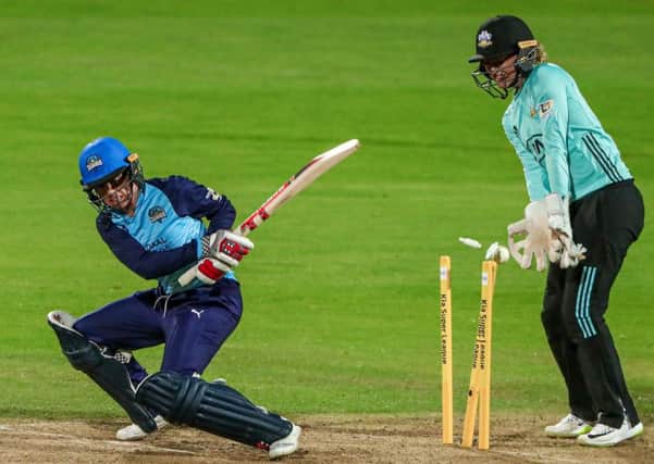 CRUCIAL MOMENT: Yorkshire captain Lauren Winfield is bowled by Surreys Natalie Sciver. Picture: Alex Whitehead/SWpix.com