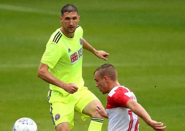 Sheffield United's Chris Basham (left) in action during the pre-season friendly match at Oakwell, Barnsley. (Picture: Tim Goode/PA Wire)