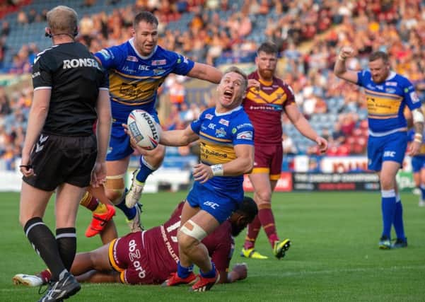 SAME AGAIN PLEASE: Brad Dwyer scores Leeds Rhinos' fourth try against 
Huddersfield Giants.
 Picture: Bruce Rollinson