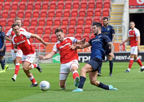 Lee Frecklington clashes with Barnsley's Alex Mowatt. Picture: Marie Caley