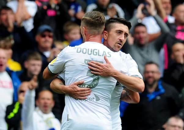 On target: Barry Douglas congratulates Pablo Hernandez after his opener. Pictures: Simon Hulme