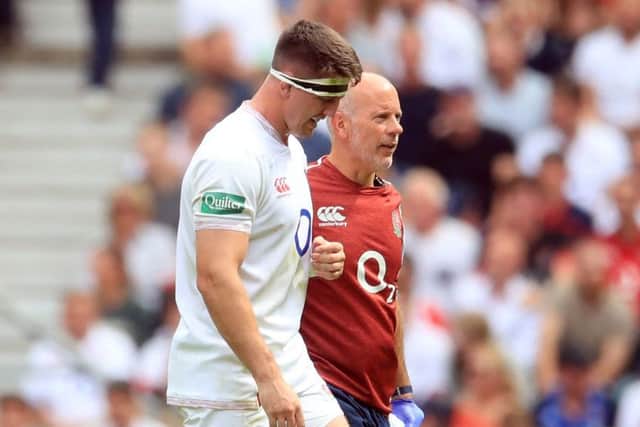 Injury doubt: England's Tom Curry leaves the pitch after picking up an injury during the International match with Wales at Twickenham Stadium, London. (Picture: Adam Davy/PA Wire)