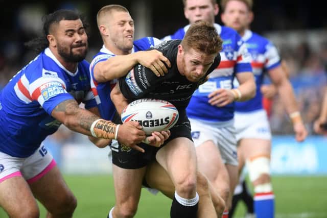 Hull's Marc Sneyd breaks through to score against Wakefield (Picture: Jonathan Gawthorpe)