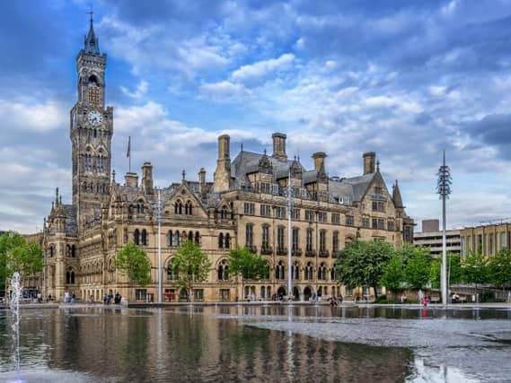 The Beck runs beneath the Mirror Pool in front of Bradford City Hall