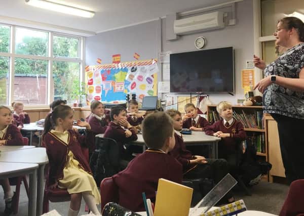 Children take part in a lesson baout deafness to mark Deaf Awareness Week.