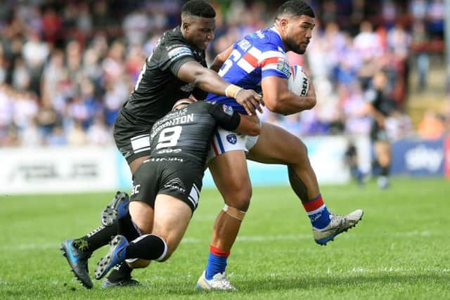 Wakefield's Kelepi Tanginoa is tackled by Hull's Danny Houghton and Masi Matongo. (Picture: Jonathan Gawthorpe)