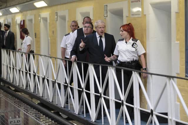 Prime Minister Boris Johnson talks with prison staff at HMP Leeds in Armley. Picture: Jon Super - WPA Pool/Getty Images.
