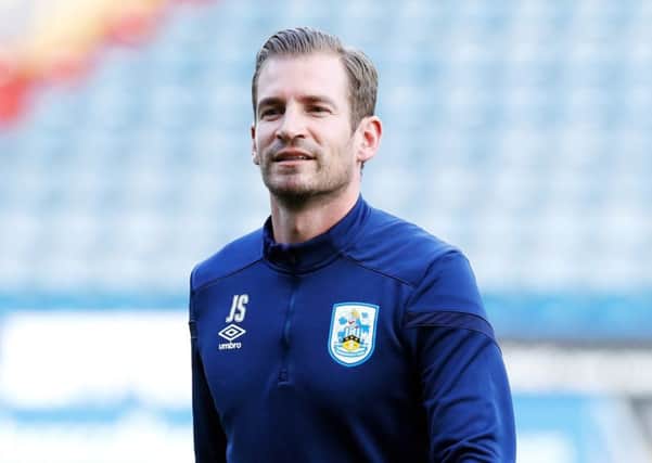 Taking it on the chin: But with just one win in 18 games, Huddersfield Town manager Jan Siewert is under increasing pressure at the John Smiths Stadium. (Picture: Martin Rickett/PA)