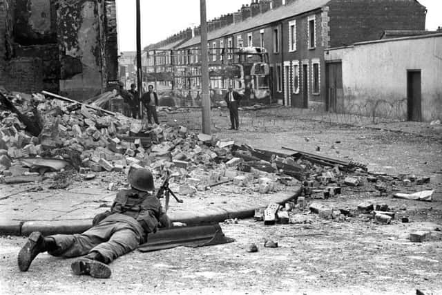 A soldier on lookout in the Falls Road area of Belfast as British troops were deployed onto the streets of Northern Ireland as part of Operation Banner in response to growing sectarian unrest.