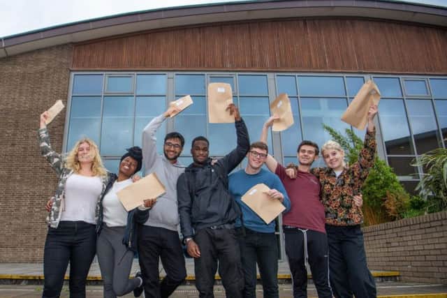 Students at Abbey Grange Church of England Academy,  Butcher Hill, Leeds, celebrating their A Level results. Pictured are Erin Kershaw-Smith, Haja Kamara, Hishaam Maqsood-Shah, Joseph Aggrey, Tom Elton, Alex Clark, and Danni Banks.