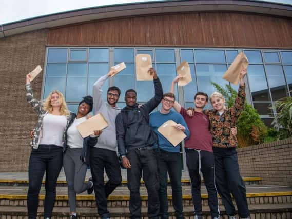 Students at Abbey Grange Church of England Academy,  Butcher Hill, Leeds, celebrating their A Level results. Pictured are Erin Kershaw-Smith, Haja Kamara, Hishaam Maqsood-Shah, Joseph Aggrey, Tom Elton, Alex Clark, and Danni Banks.