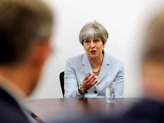 Theresa May promoted her review of tuition fees during a visit to Leeds in February 2018. Pic: Simon Hulme
