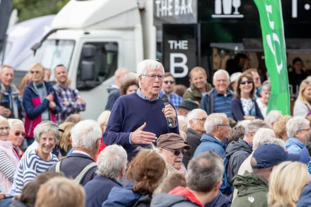John Craven, a former reporter for The Yorkshire Post and a long-serving presenter for BBC's Countryfile, speaking to the public on the opening day of Countryside Live at Castle Howard. Picture by Charlotte Graham.